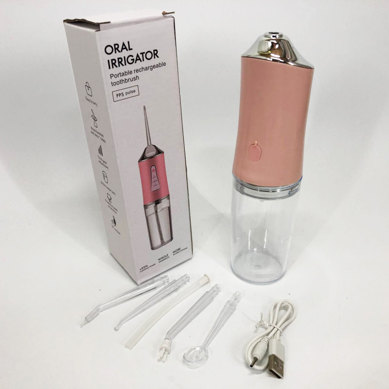Іригатор для чищення зубів та порожнини рота Oral Irrigator з акумулятором та змінними насадками Pink